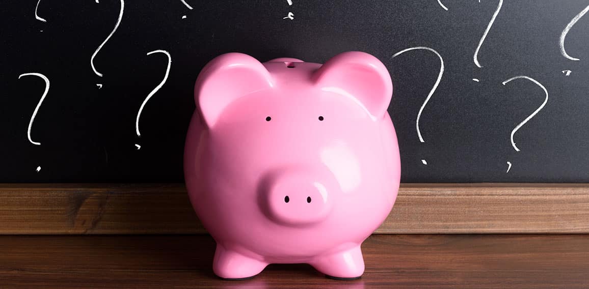 Piggy Bank With Question Mark On Black Board