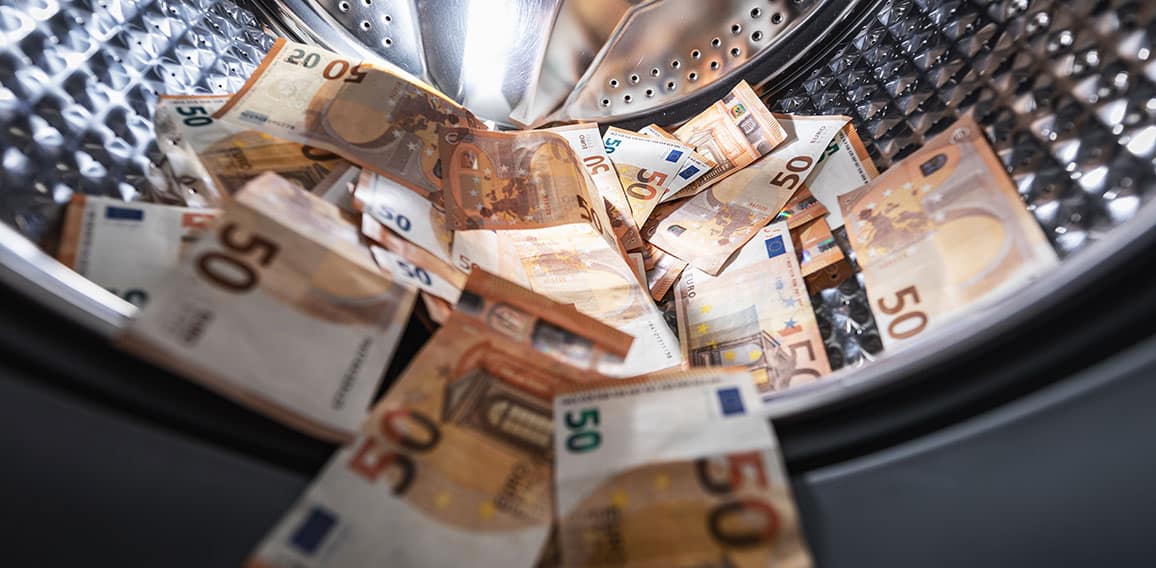 money laundering concept - euro banknotes in washing mashine