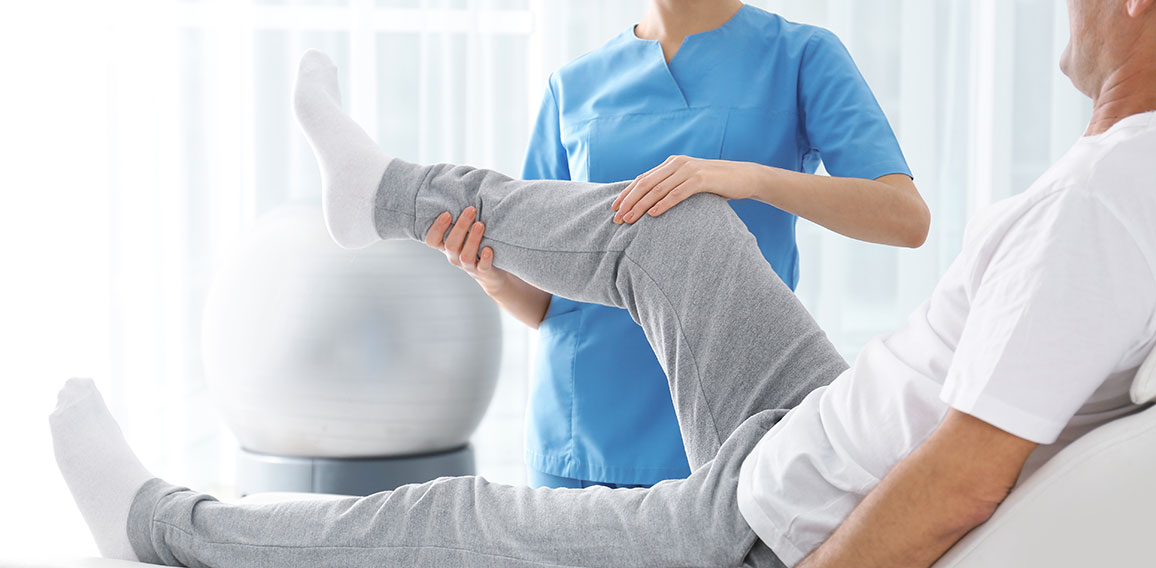 Doctor working with patient in hospital, closeup. Rehabilitation