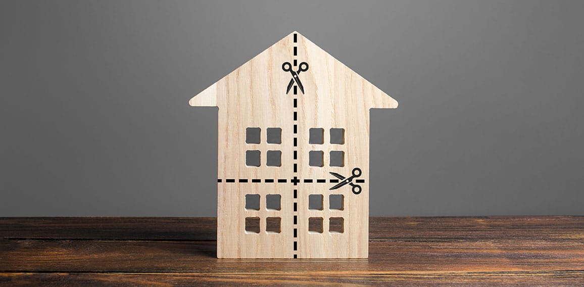 Residential building divided by a dotted line into four equal parts. Distribution of the right. Divorce concept. Disputes over division process of real estate and property after divorce.