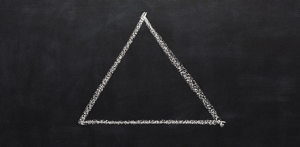 Triangle drawn with chalk on blackboard