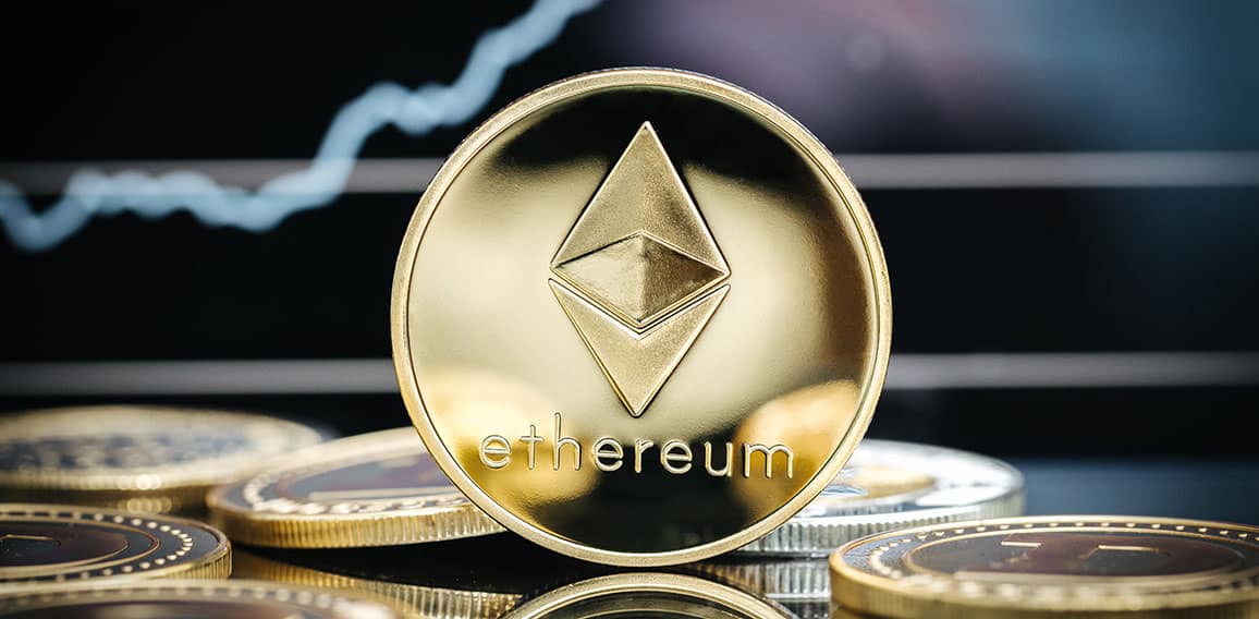 Ethereum cryptocurrency, physical coin close-up in front of a pr