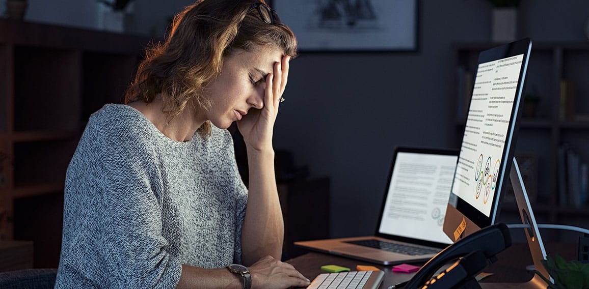 Stressed woman working over time at night