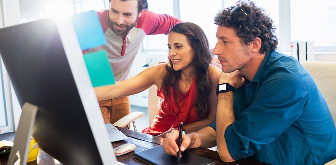 Colleagues using a graphic pad