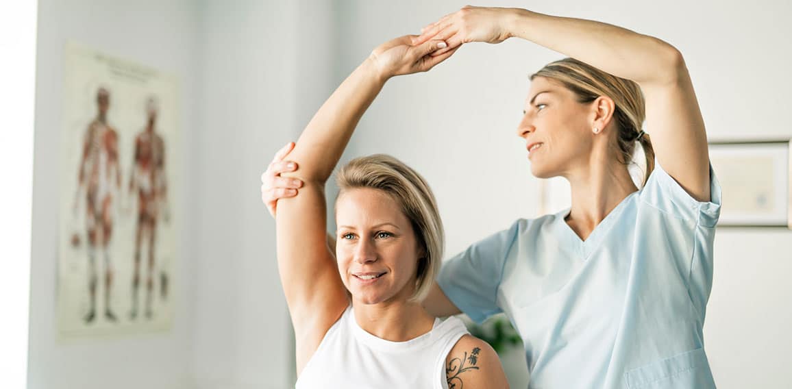 A Modern rehabilitation physiotherapy worker with woman client