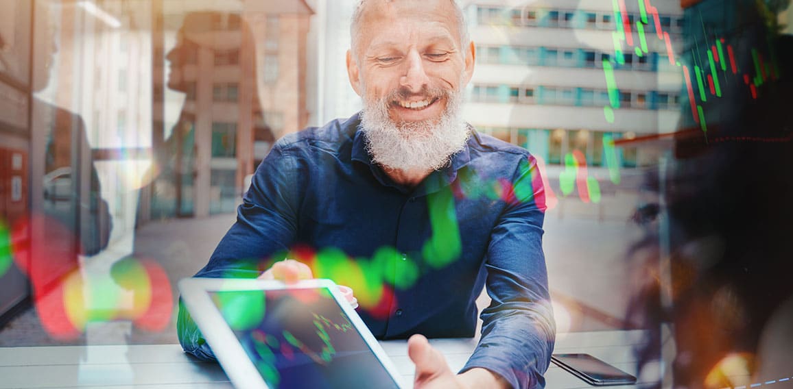 Businessman shows trading stock market chart on a tablet