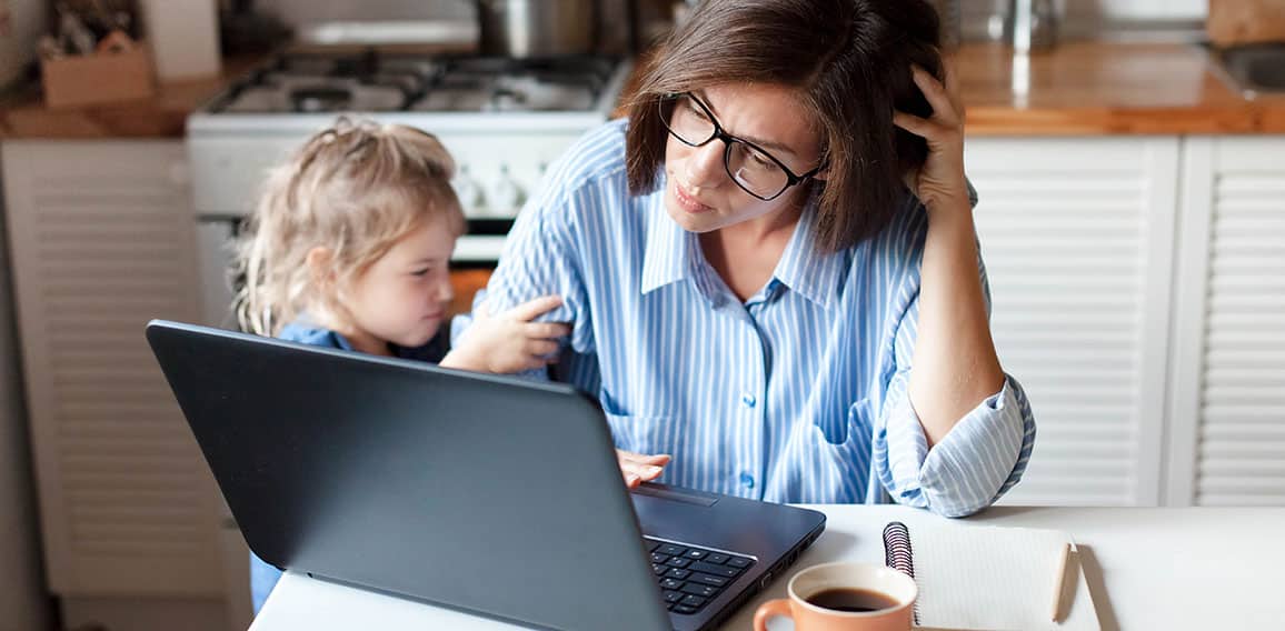 Working mother in home office. Unhappy woman and child using laptop. Sad and angry daughter