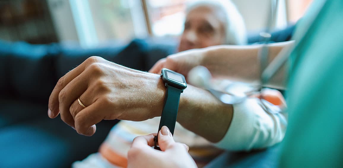 Smartwatch for assisted living. A woman from the medical health