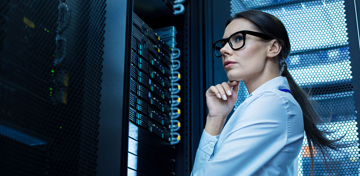 Professional young woman working in a data center