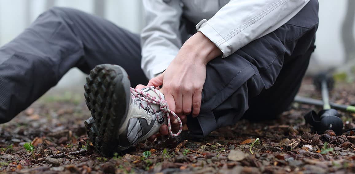 Trekker complaining alone in the mountain with broken ankle