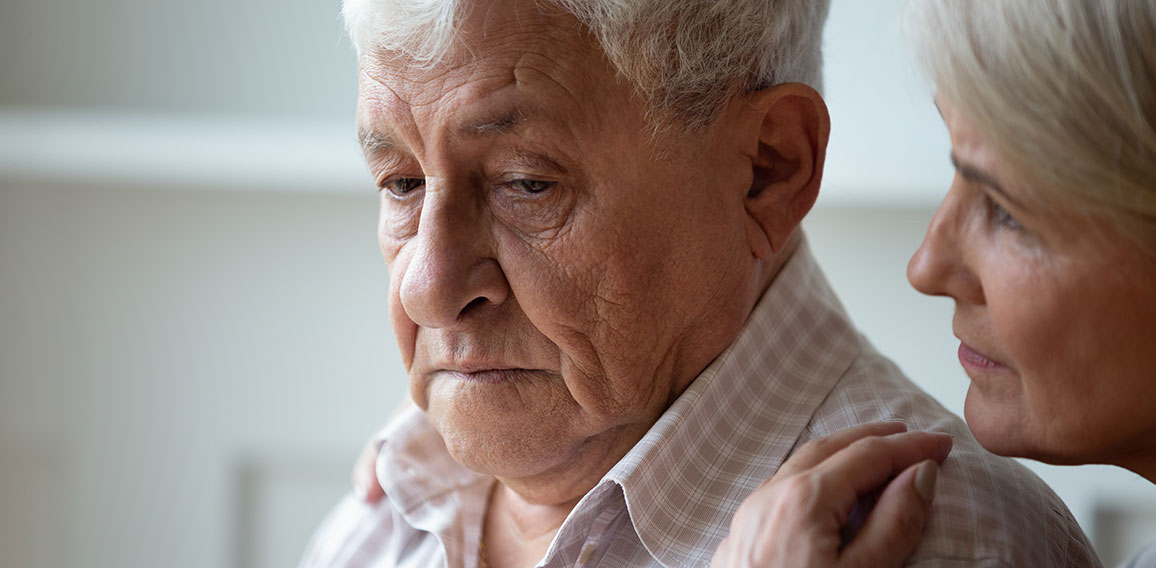 Caring old wife support caress sad senior husband