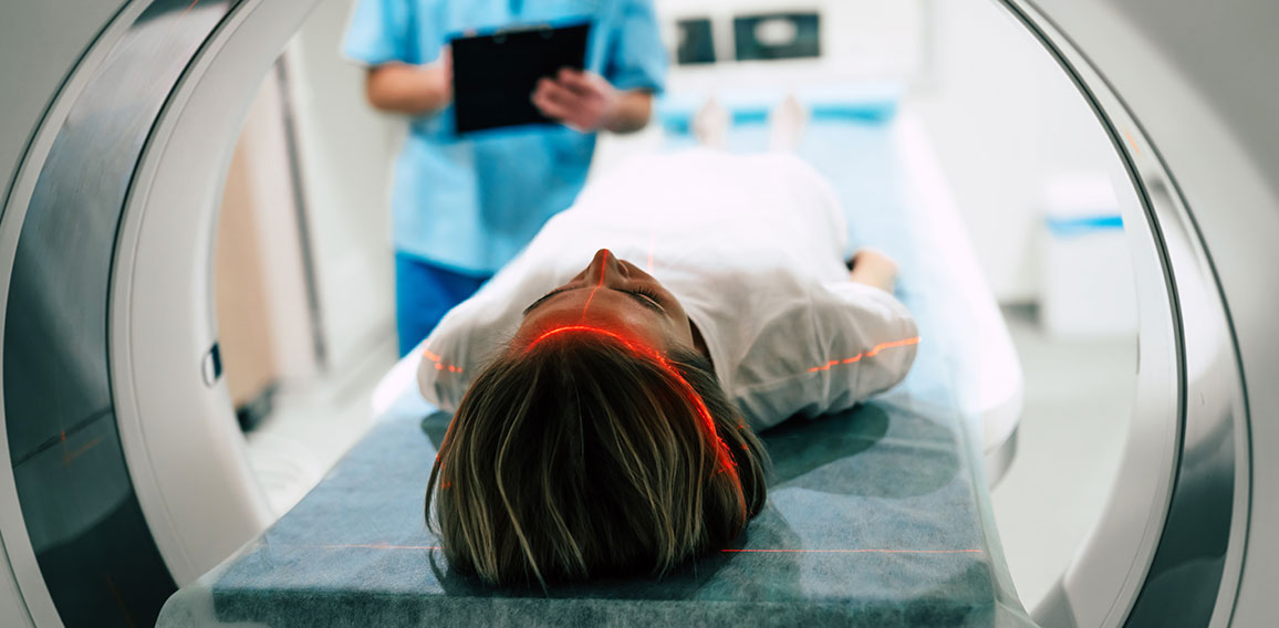 Young woman patient is ready to do magnetic resonance imaging in