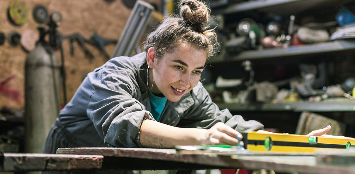 young woman working in workshop