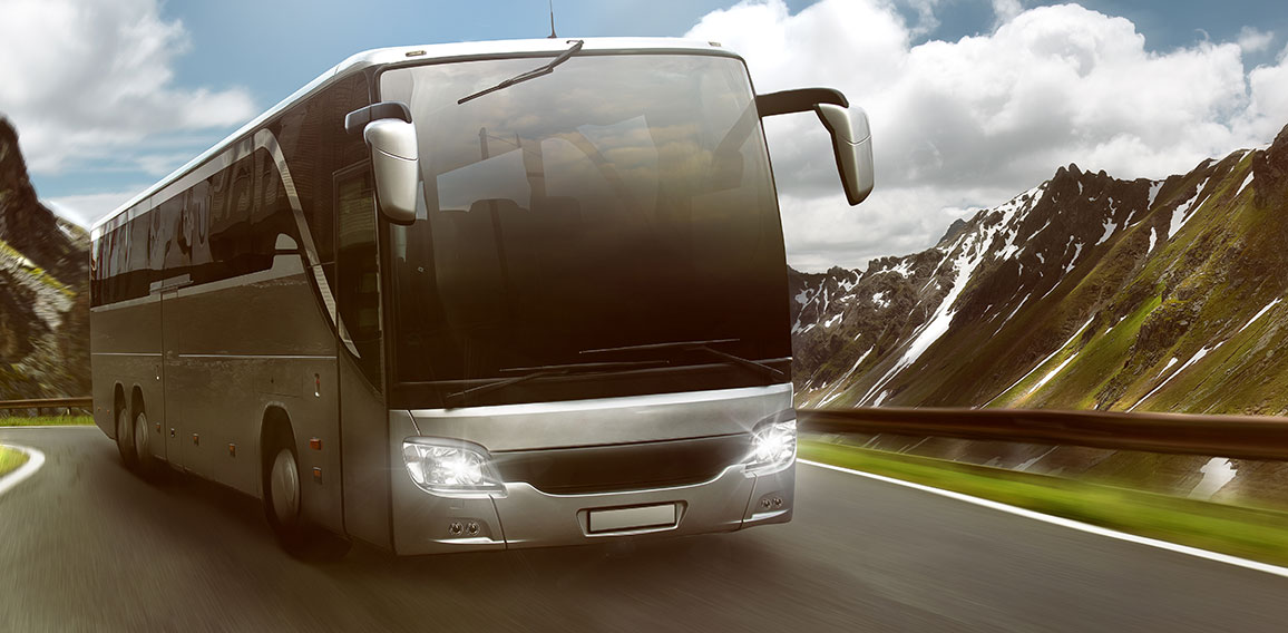 Bus in front of mountain landscape