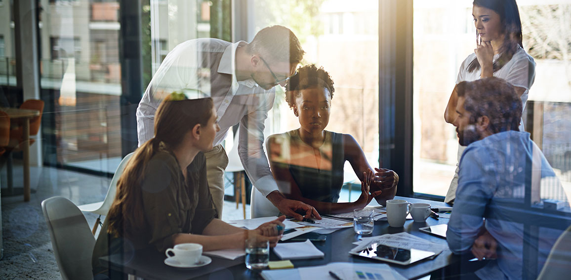 They give their all at work. Shot of a group of businesspeople having a meeting in a boardroom.