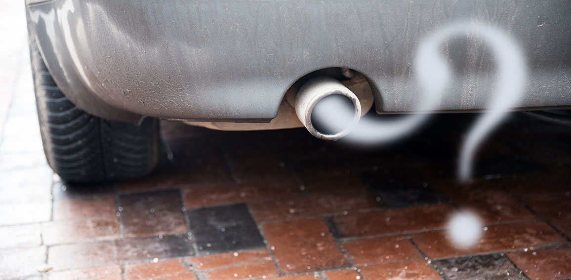 Exhaust from a car with diesel engine emitting gas in the shape