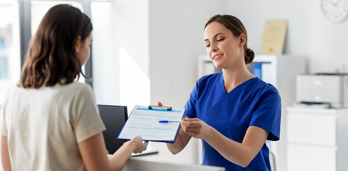 doctor with clipboard and patient at hospital