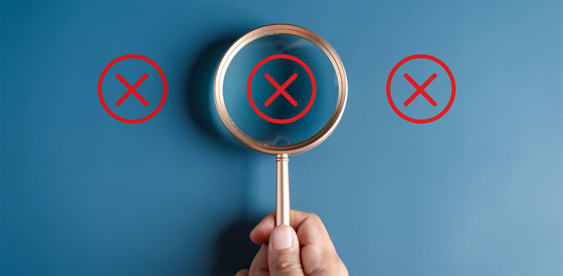 Businessman holding magnifier focus to correct icon which among wrong icon on wooden block for document and project approve, check, mark.