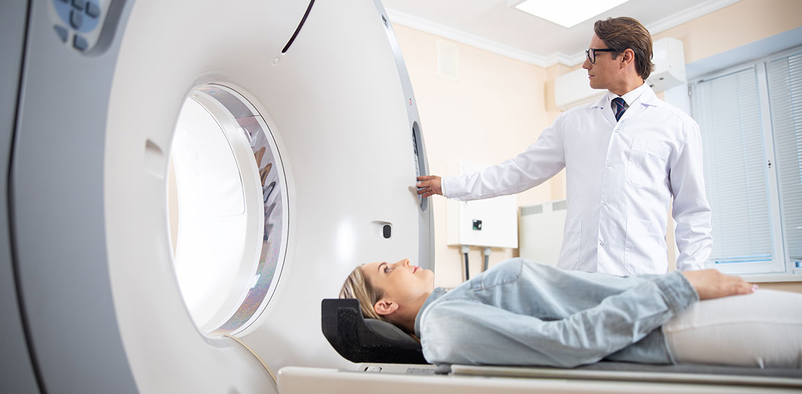 Young lady having CT scan in hospital