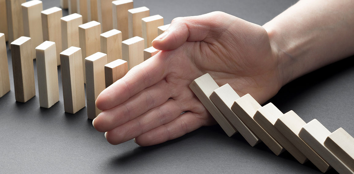 The financial crisis and economic decline. Businessman hand stop