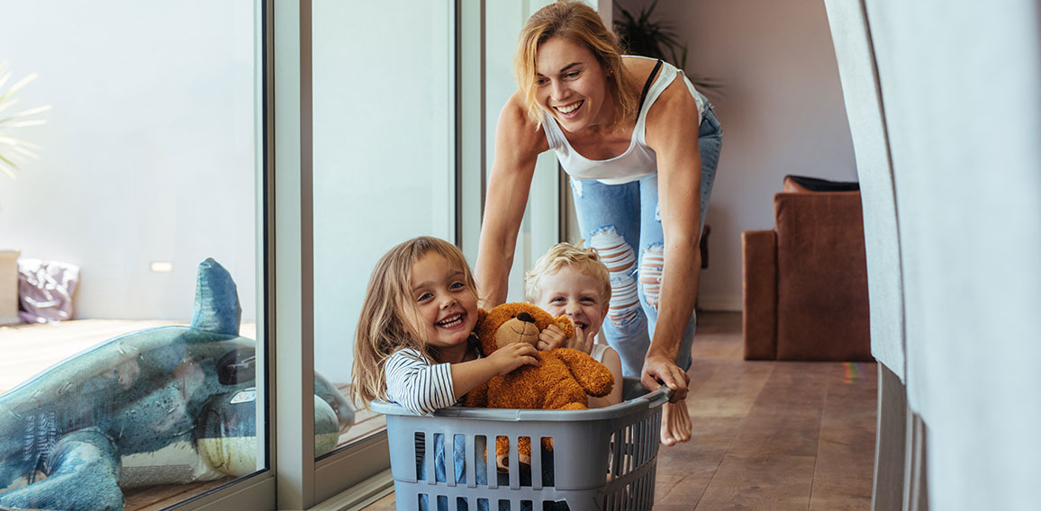 Mother playing with her children at home