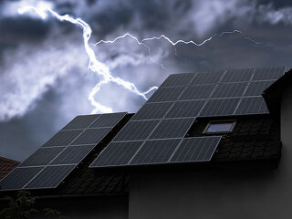 Dark cloudy sky with lightning over house. Stormy weather