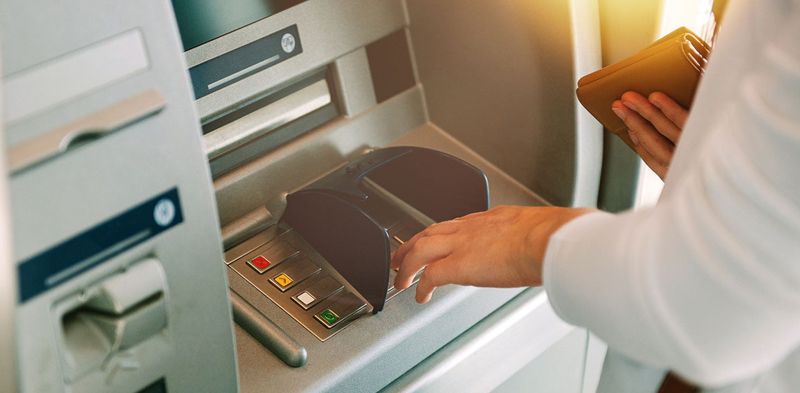 Woman pressing key pin code holding wallet