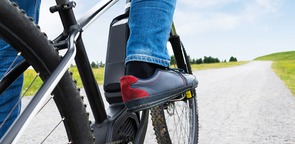 Man Riding Electric Mountain Bike