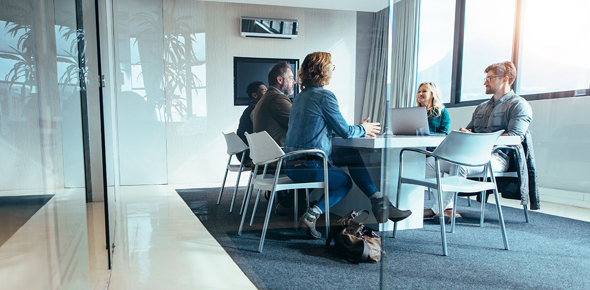 Group of business people having discussion in conference room