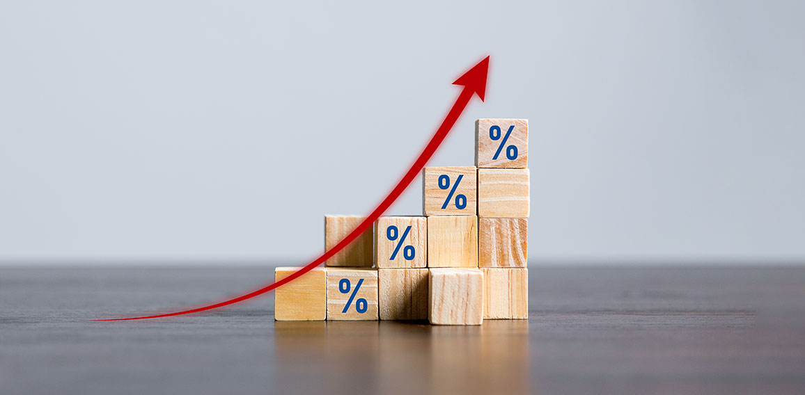 Closeup wood cubes with percentage symbol, Percent and upwards increasing arrows on wooden cubes. Financial interest mortgage rates increase or price commission raise, growth business, finance tax.