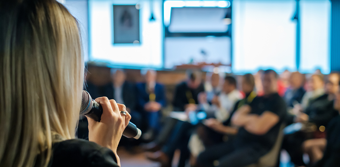 Female presenter speaks to audiences