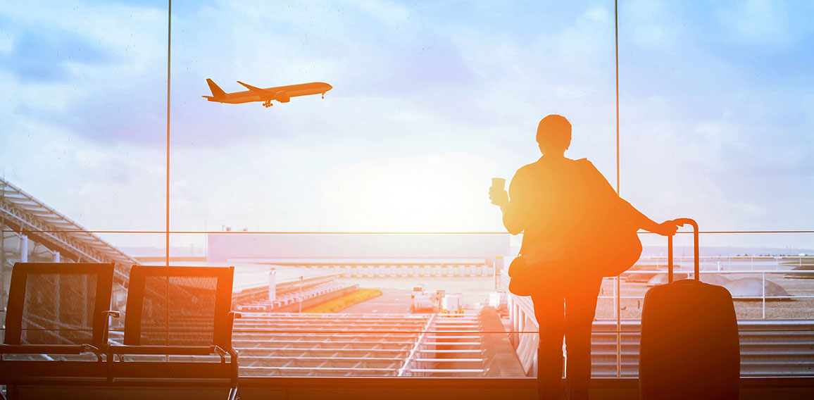 happy traveler waiting for the flight in airport, departure term