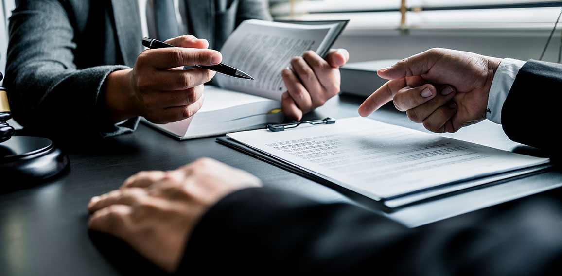 Close up of businessmen or lawyers discussing contract or busine