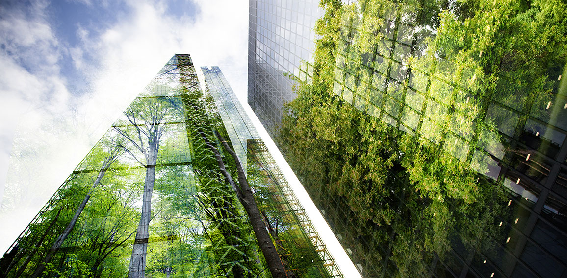 green city - double exposure of lush green forest and modern sky