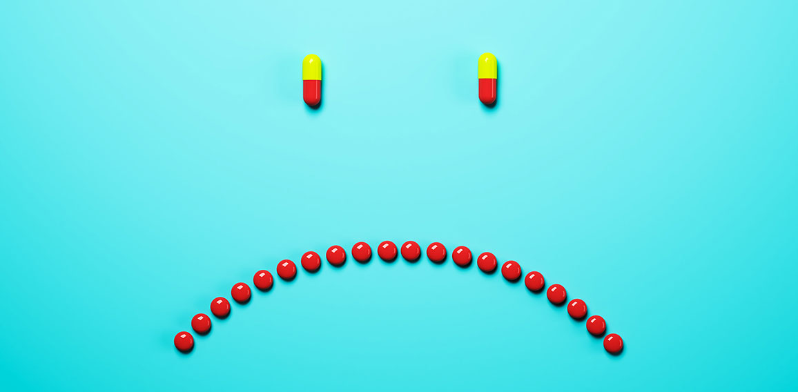 Abstract frowning pills background