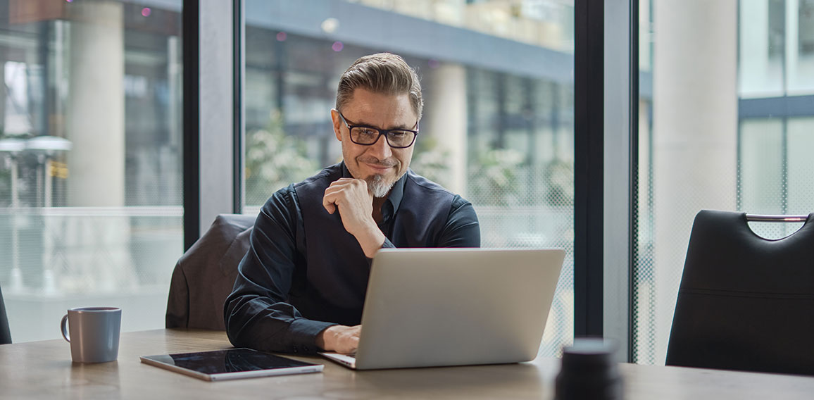 Businessman working with laptop in office