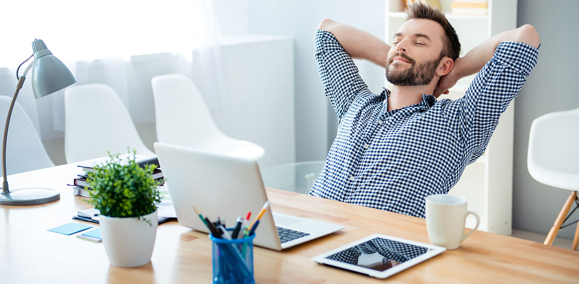 Young worker having break and resting after solving task