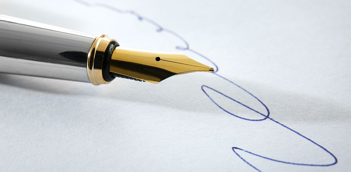 Notary public signature and fountain pen, close up view