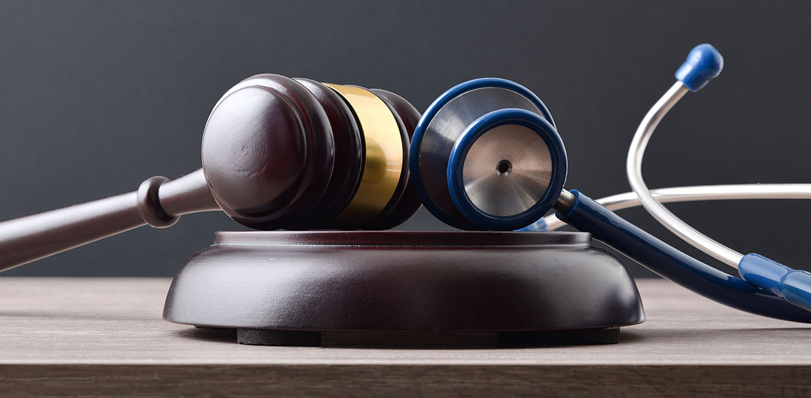 Fair social justice concept with gavel and stethoscope front vie