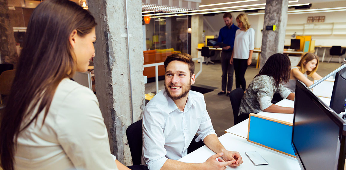 People working at busy modern office