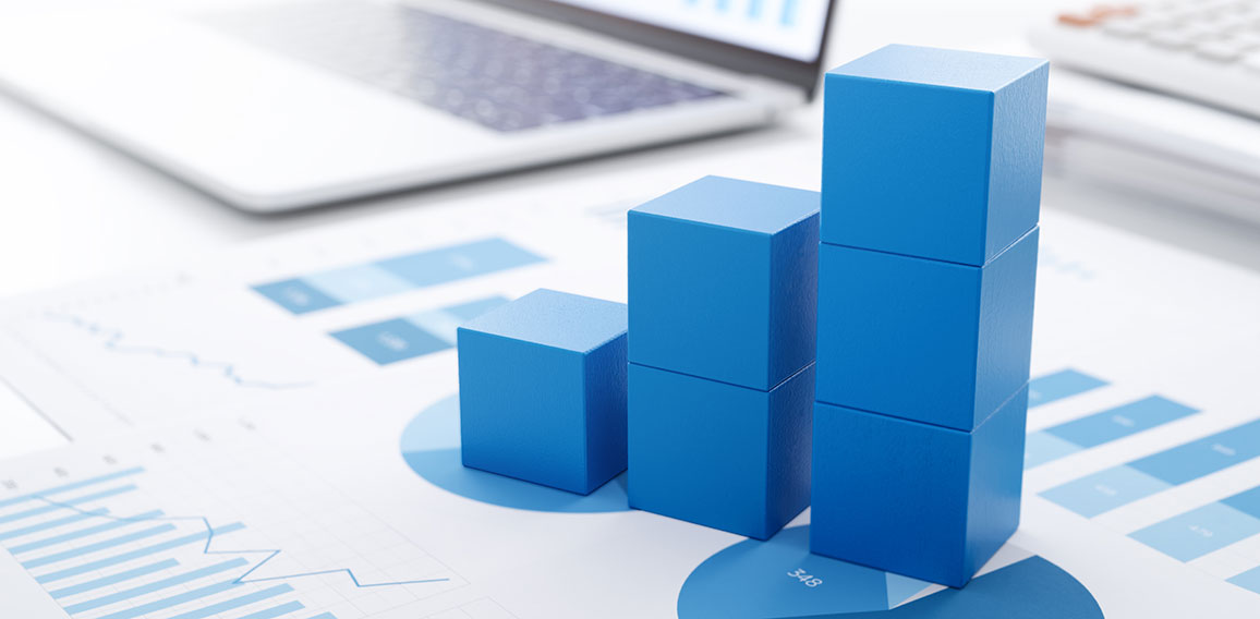 Business growth and analysis.　Many graphs on reports and lapto