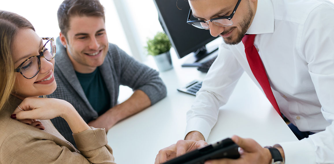 Business man explaining terms of contract to his clients in the