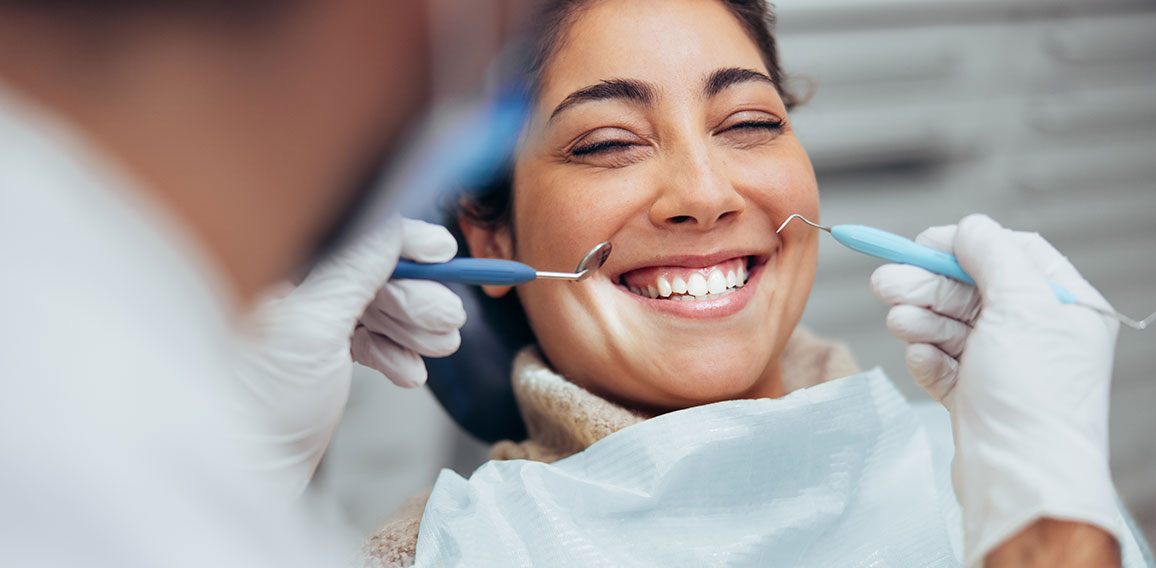 Woman smiling during dental checkup