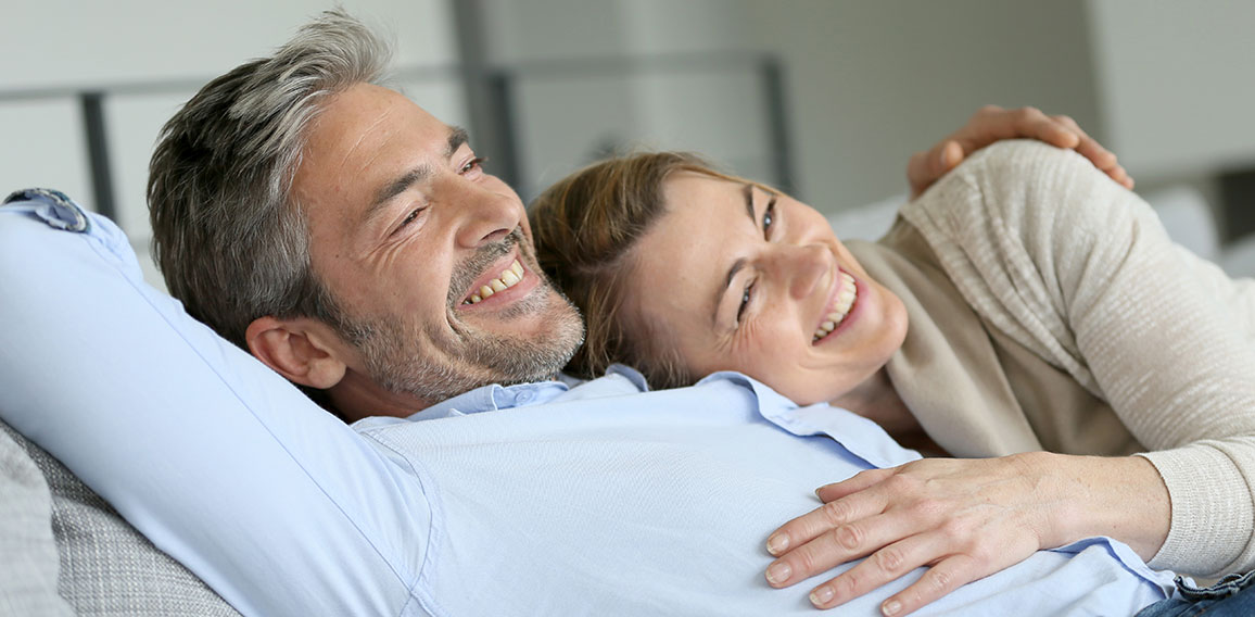 Mature couple relaxing in sofa, peaceful scene