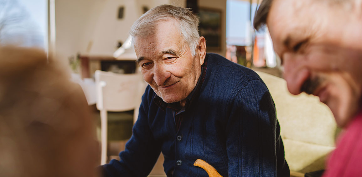 Portrait of senior man 80 years old pensioner sitting in chair w