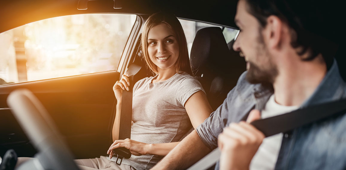 Couple at car dealership