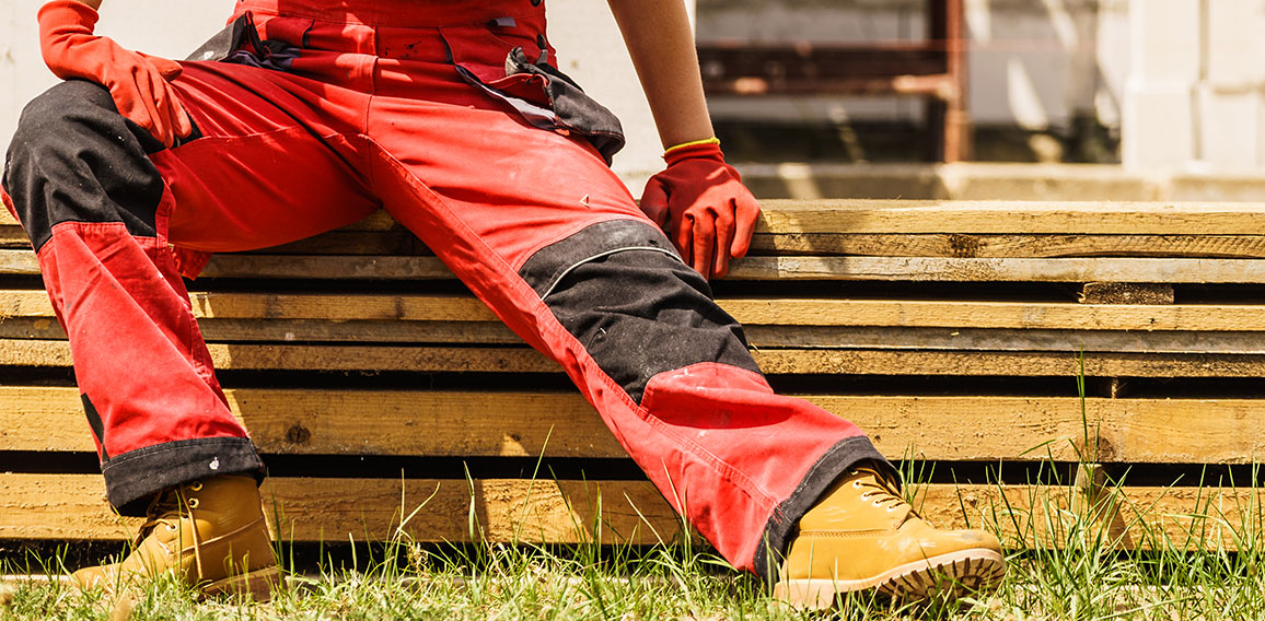 Person wearing red worker trousers