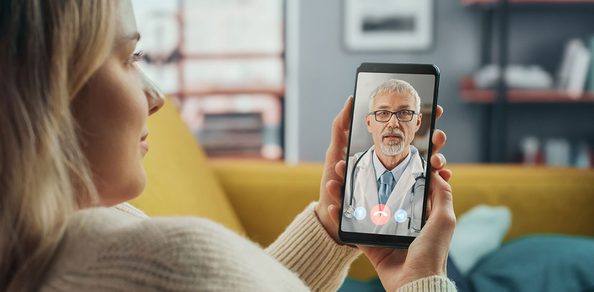 Close Up of a Female Chatting in a Video Call with Her Senior Fa