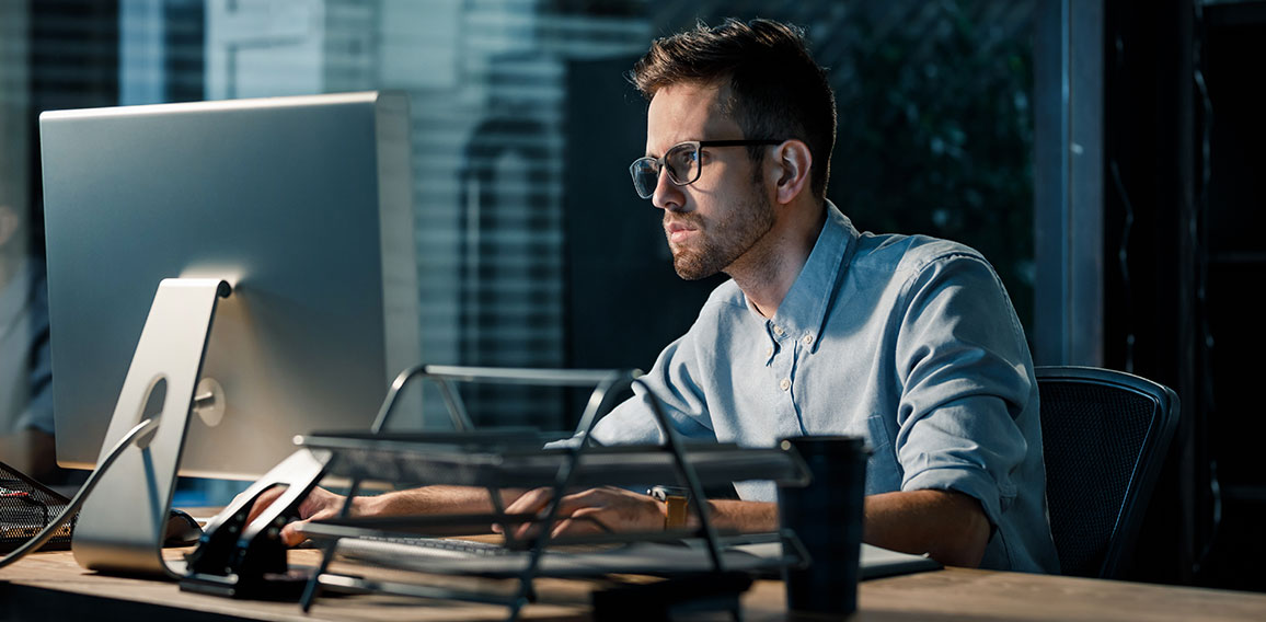 Man working late at night in office