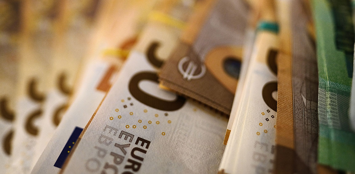 Bundled euro banknotes with selective focus